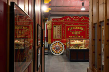 Vintage circus exhibit with models and memorabilia.