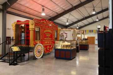 Vintage circus wagon display in museum.