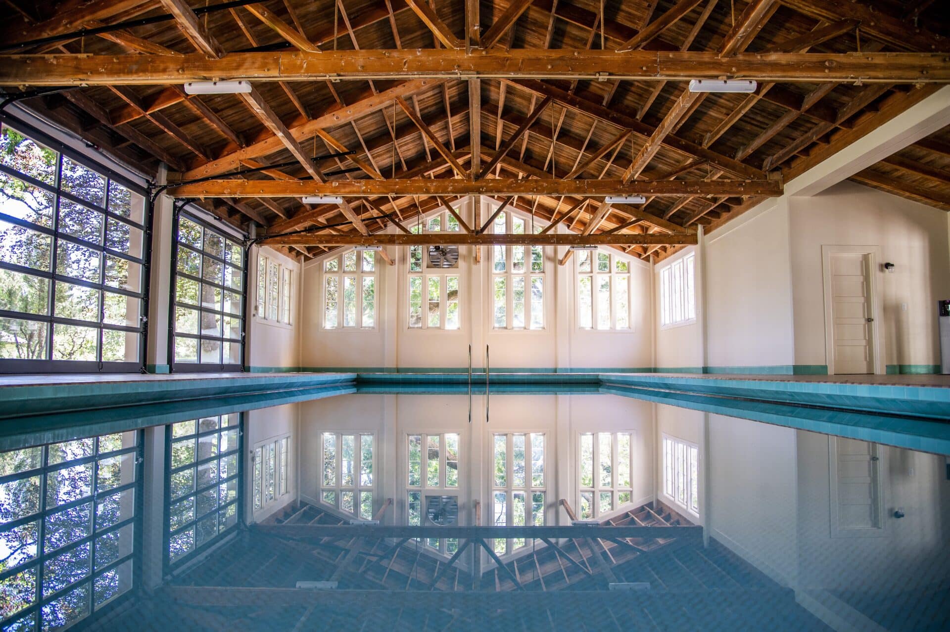 Indoor swimming pool with wooden ceiling