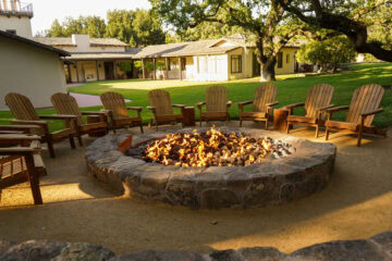 Outdoor fire pit with surrounding chairs