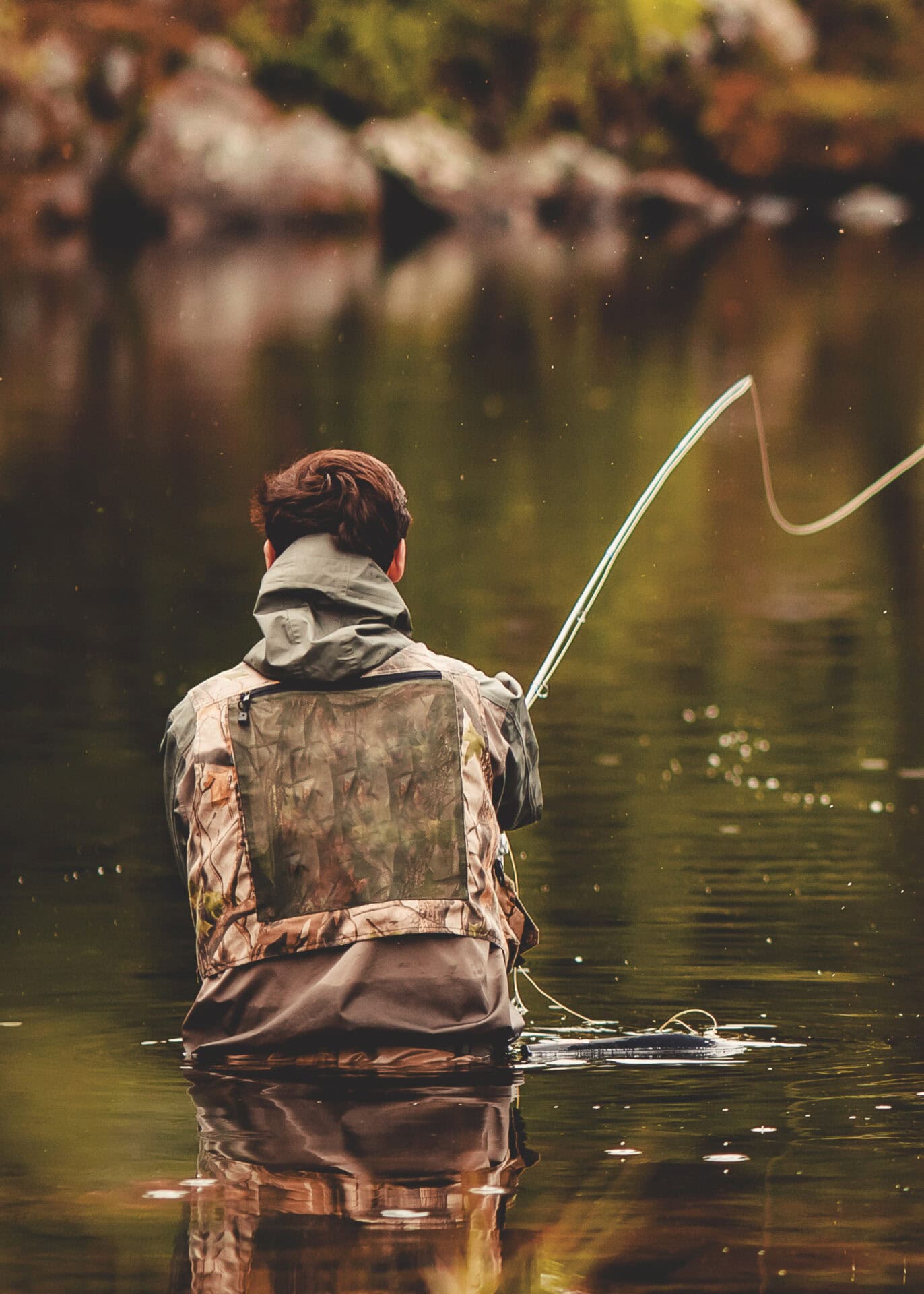 Person in water fly fishing